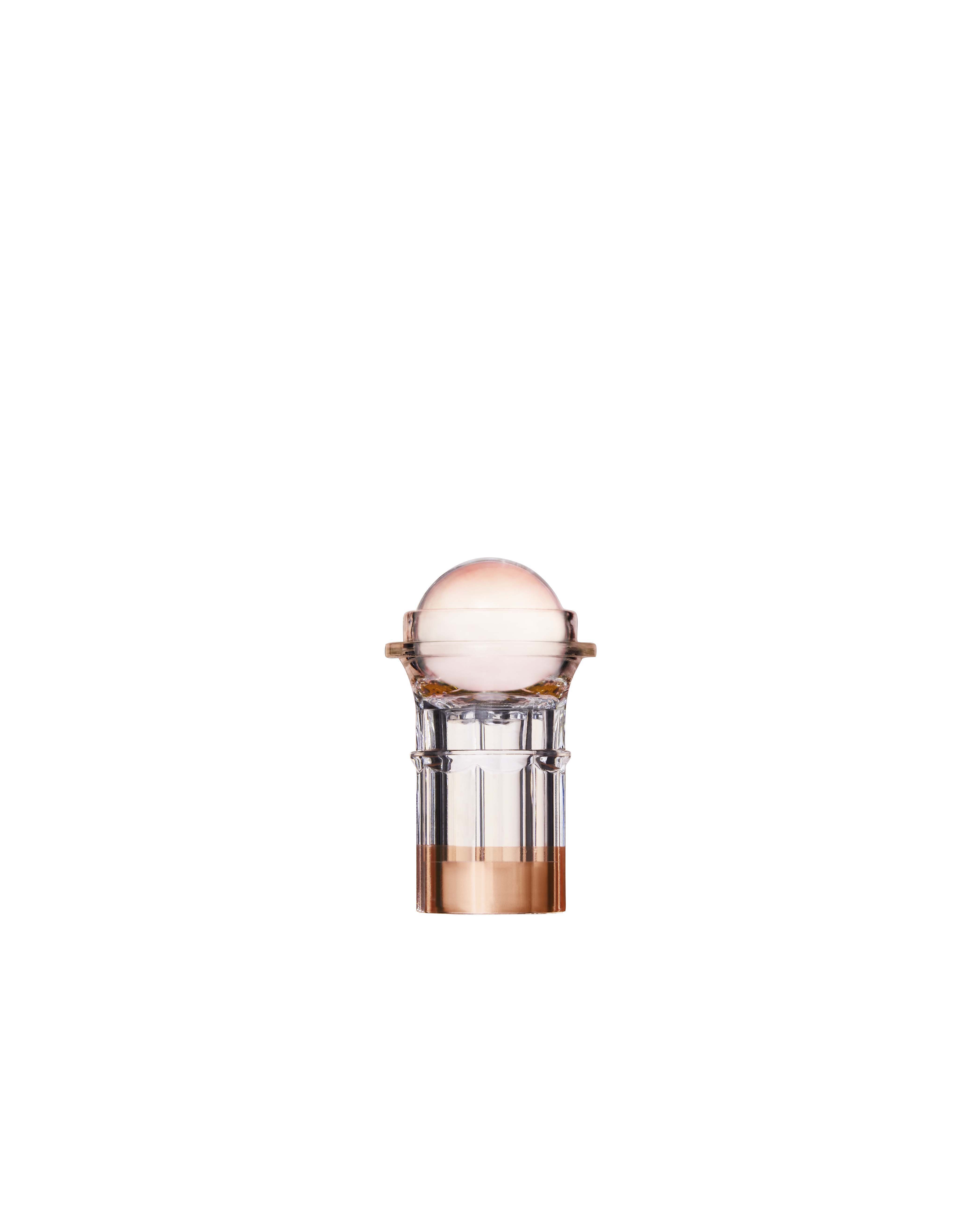 A cosmetic serum bottle with a white and clear design, likely made of plastic and glass, with a pump dispenser.