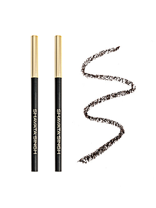 Two eyebrow pencils with golden caps and a swatch of the pencil showing a dark black color.